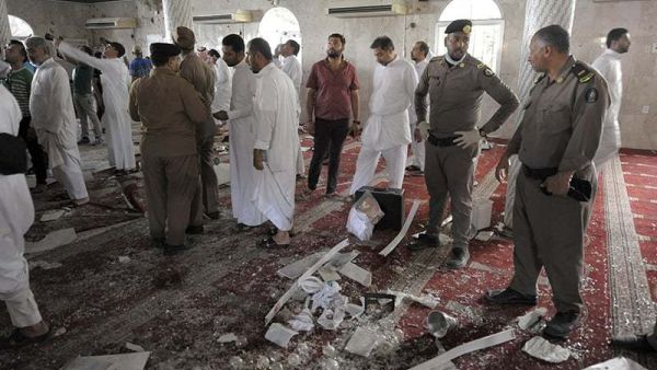 Saudi policemen gather around debris following a blast inside a mosque in Qatif. (AFP/File) 