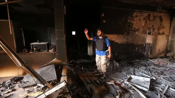 A fighter from the Government of National Unity (GNA) stands in a severely damaged state regulation prison after taking control of the area from the Daesh group in Sirte, east of the capital on August 26, 2016.