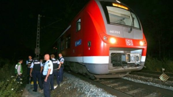 A rescuer at the scene of an axe and knife attack by a 17-year-old Afghan refugee on a regional train in Wuerzburg, southern Germany, on July 18, 2016. (AFP/Karl-Josef Hildenbrand)