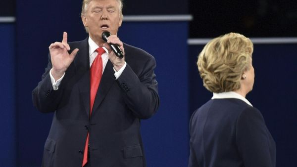 Republican presidential candidate Donald Trump makes a point to Democratic presidential candidate Hillary Clinton during the second presidential debate at Washington University in St. Louis, Missouri on October 9, 2016. (AFP/Paul J. Richards)