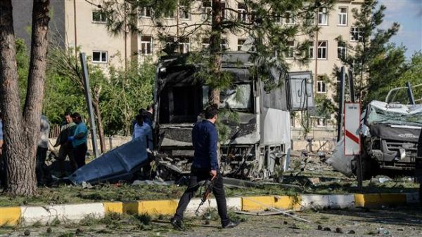 A Turkish plainclothes police office walks on the site of a bomb explosion in Diyarbakir, Turkey, May 10, 2016.  (AFP/File) 