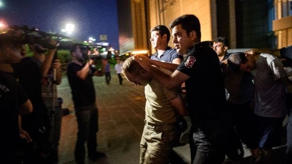 Police escort soldiers in a roundup after a military coup in Turkey (AFP/Ozan Kose)