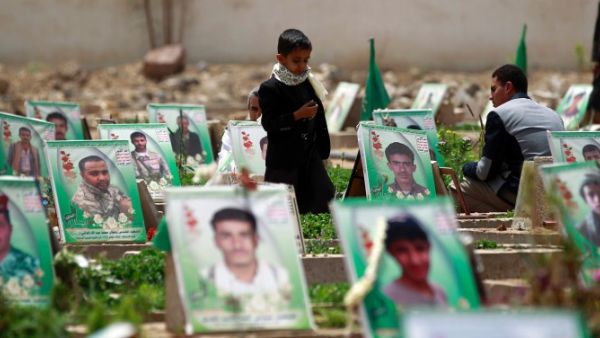 Yemenis visit the grave of relatives reportedly killed by Saudi-led coalition forces. (AFP/file) 