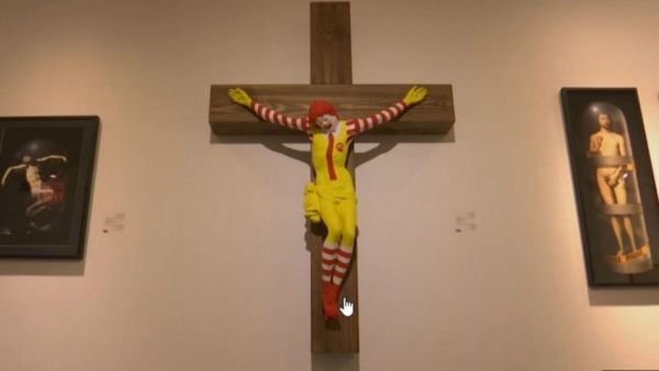 An art exhibit depicting a fast-food clown nailed to a cross is to be taken off. (Twitter)