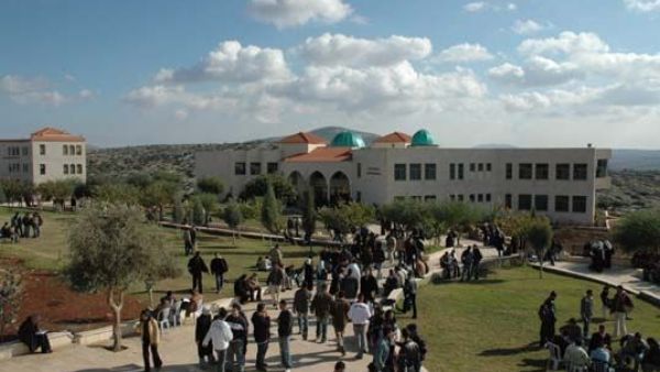 Students arrive at the Arab American University in Jenin, West Bank. (Wikimedia Commons)