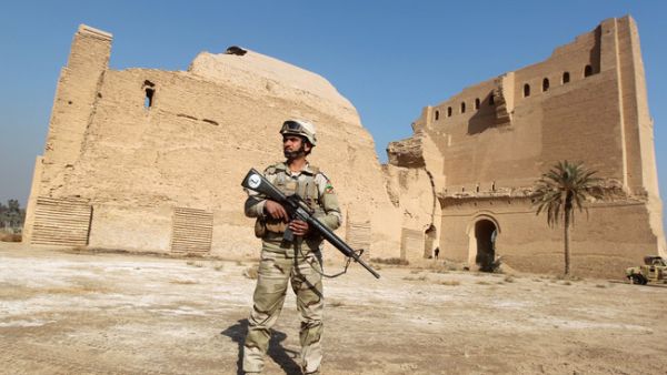 A soldier outside an Iraqi archaeological site (Ahmad al-Rubaye/AFP)