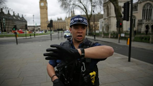 An armed policeman guards the Houses of Parliament in London. (AFP)