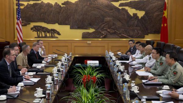 China urges US to take more caution before action. [AFP]