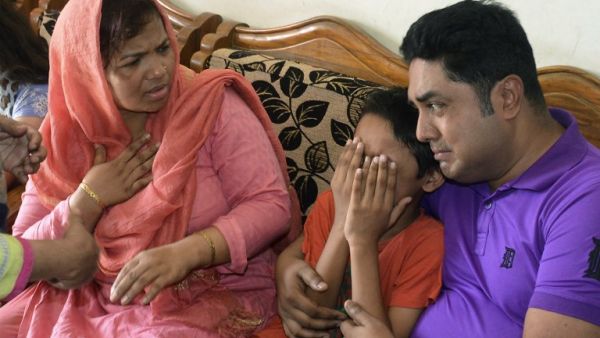 The young son of Mahmuda Aktar, the wife of a top Bangladeshi anti-terror officer, mourns after she was shot dead near her home in Chittagong on June 5, 2016. (AFP/ The young son of Mahmuda Aktar, the wife of a top Bangladeshi anti-terror officer, mourns after she was shot dead near her home in Chittagong on June 5, 2016. (AFP/