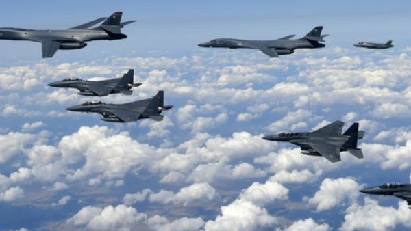 South Korean Defence Ministry handout photo shows USAF B-1B Lancer bombers (L), US F-35B stealth jet fighters (far R) and S. Korean F-15K fighter jets (foreground) over South Korea. (AFP/ File Photo)
