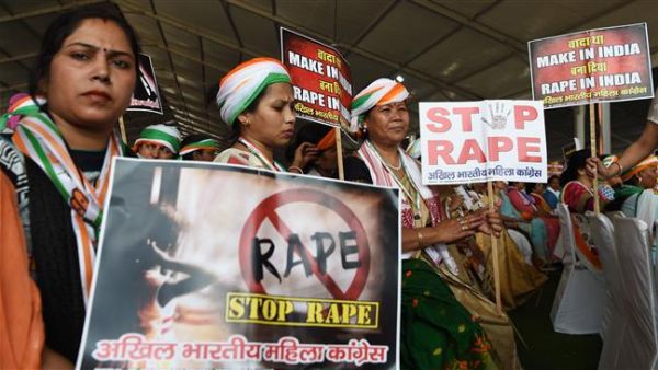 Indians hold placards in reaction to a rape case during a rally in New Delhi on April 29, 2018. (AFP/File Photo) 