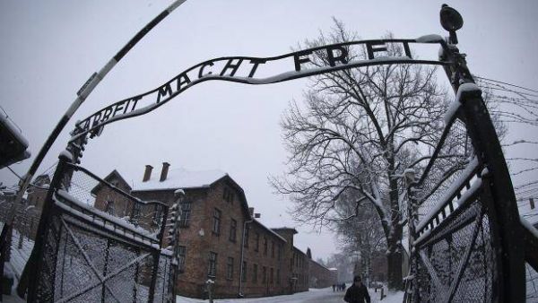 Entrance to the Nazi death camp Auschwitz-Birkenau with the lettering 'Arbeit macht (AFP/File Photo)	