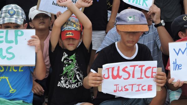 Refugee children take part in a protest in March 2015 against their resettlement on Nauru and living conditions on the island. (Amnesty International) Refugee children take part in a protest in March 2015 against their resettlement on Nauru and living conditions on the island. (Amnesty International)