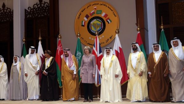 May poses for a photo this morning at the GCC summit (Stringer/AFP)