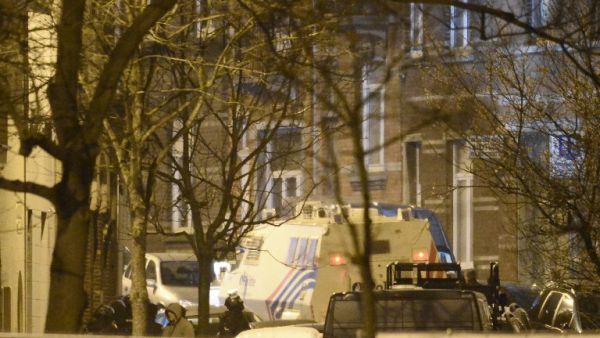 Police stand close to the suspects' apartment in the Forest district of Brussels, Belgium. (AFP/Dirk Waem) Police stand close to the suspects' apartment in the Forest district of Brussels, Belgium. (AFP/Dirk Waem)