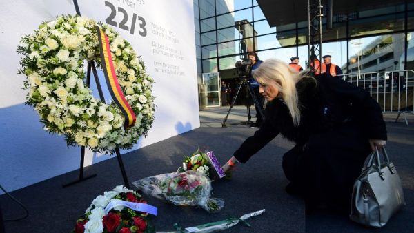 A woman places flowers at Brussels' international airport in Zaventem during a memorial ceremony to mark the first anniversary of the twin Brussels attacks on March 22, 2017. (Emmanuel Dunand) A woman places flowers at Brussels' international airport in Zaventem during a memorial ceremony to mark the first anniversary of the twin Brussels attacks on March 22, 2017. (Emmanuel Dunand)