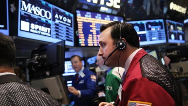 As investors wait for the Federal Reserve's policy-making committee to conclude its two-day meeting, the Dow Jones industrial average, S&P 500 and the Nasdaq all declined 0.4% in morning trading. (Photo by Spencer Platt/Getty Images) 