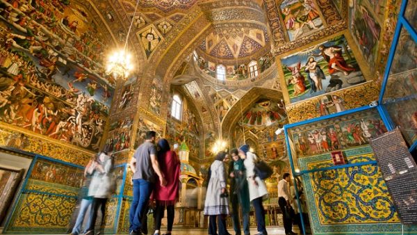 Tourists stand inside the Armenian Cathedral in Isfahan on October 15, 2014. The Cathedral, also known as the Church of the Saintly Sisters, was built in 1664. (Shutterstock)   Tourists stand inside the Armenian Cathedral in Isfahan on October 15, 2014. The Cathedral, also known as the Church of the Saintly Sisters, was built in 1664. (Shutterstock)