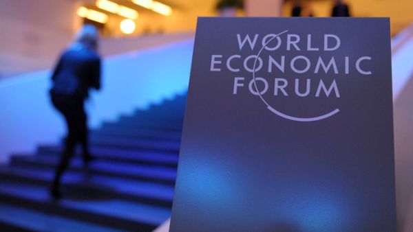 Participants arrive at the congress center prior to the opening of the World Economic Forum in Davos on January 21, 2014. (AFP/ File)