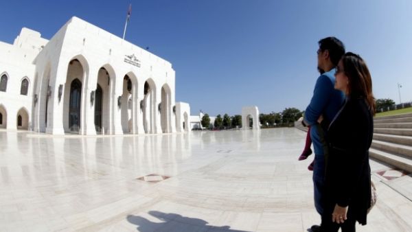 Tourists stand in front of the Royal Opera House in Omani capital Muscat. (AFP/File)