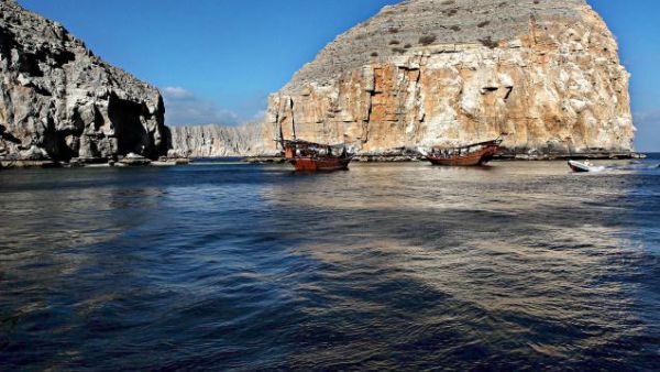 Dhows carrying tourists cruise off the Oman's Khasab shores along the Strait of Hormuz. (AFP/File)