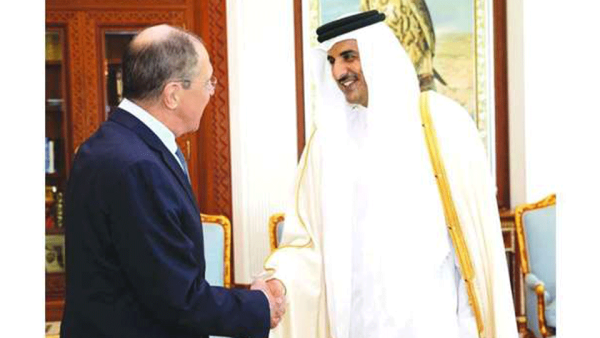 His Highness the Amir Sheikh Tamim bin Hamad al-Thani at his Amiri Diwan Office shakes hand with Russian Foreign Minister Sergey Lavrov. (Gulf Times)
