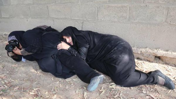 A female Iranian photojournalist taking pictures during a deadly attack on a military parade in southwestern Iranian city (Mehr News Agency/Twitter)
