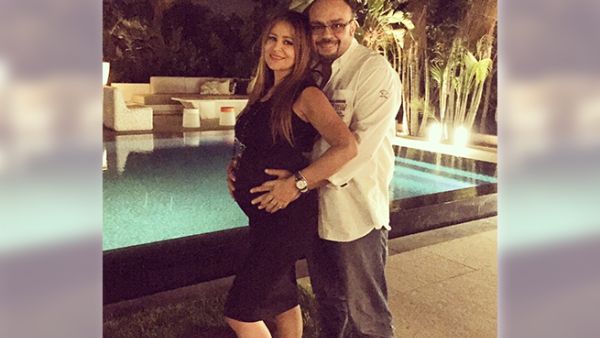 Picture perfect: Carole and her hubby with their bundle of joy. (Facebook)