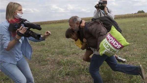 The father and son were tripped up by Petra Laszio as they tried to flee from police. (Screenshot)