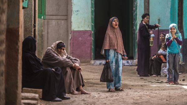 An Egyptian girl pauses in an alley in the village of al-Jendyaa, in the Bani Mazar province, in the Minya governorate south of Cairo. (AFP/File)