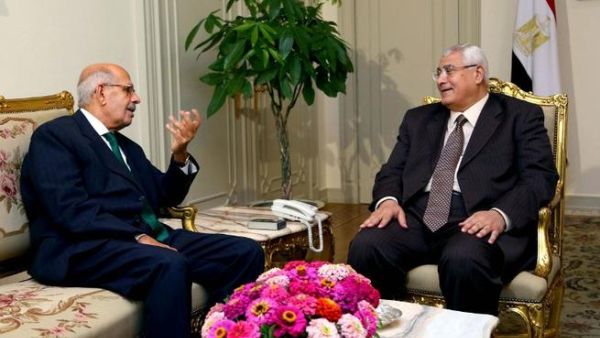 A handout picture released by the Egyptian Presidency shows Egypt's interim president Adly Mansour meeting with opposition National Salvation Front leader Mohamed El Baradei (AFP)