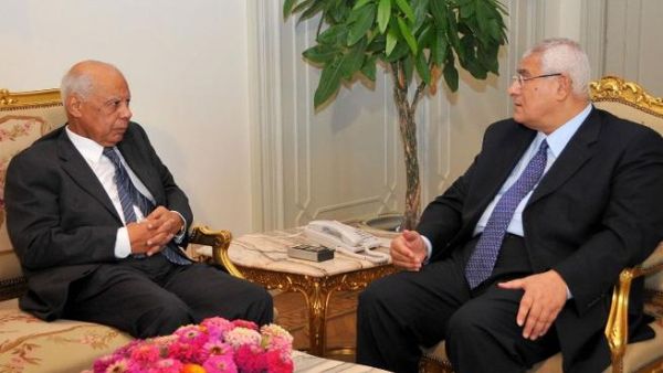 Egypt's interim president Adly Mansour (R) meeting with with new-appointed Prime Minister Hazem al-Beblawi, on July 9 (AFP/ Egyptian presidency)