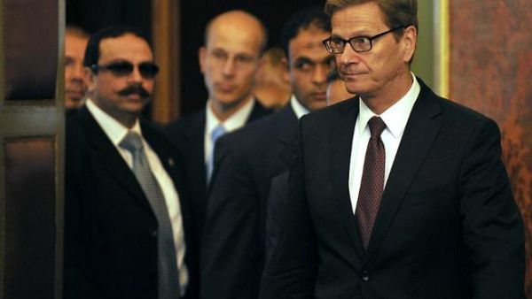 EGYPT, Cairo : German Foriegn Minister Guido Westerwelle (R) arrives with his Egyptian counterpart Nabil Fahmy (unseen) to give a joint press conference following their meeting in Cairo on August 1, 2013. AFP PHOTO/FAYEZ NURELDINE