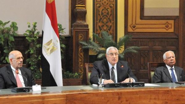 EGYPT, Cairo : A handout picture released by the Egyptian Presidency shows Egypt's vice president Mohamed El Baradei, interim president Adly Mansour and prime minister Hazem El-Bablawi attending the first meeting of the 20 newly appointed Egyptian Governors on August 13, 2013 in Cairo. AFP PHOTO / HO /EGYPTIAN PRESIDENCY 