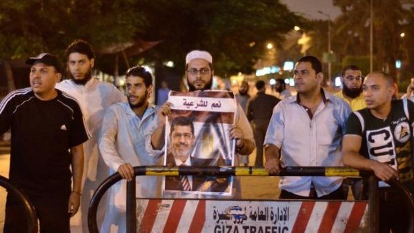 Muslim Brotherhood supporters in Cairo react to the announcement that Egyptian constitution had been suspended and Mohamed Morsi ousted as President (AFP)