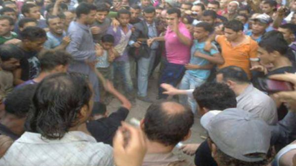 Angry Mob Beating A Shiite in Zawya Abu Muslam village (Source:Hazem Barakat)
