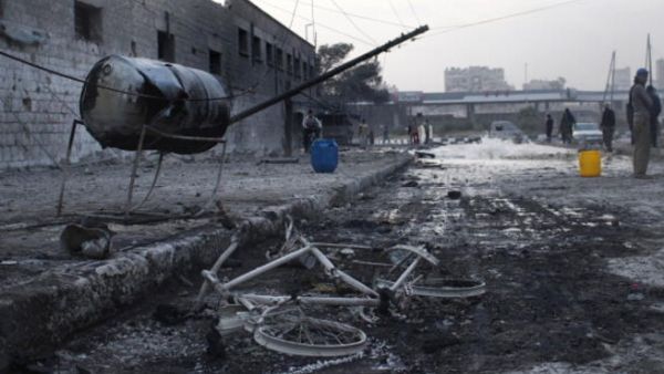 An air strike by pro-government forces on the Syrian city of Aleppo on November 28, 2013. [Mohammad Al-Khattib/AFP]