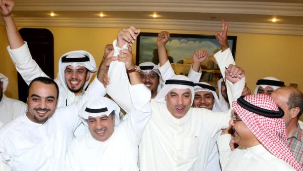 Kuwaiti candidate Faisal al-Shayaa (C) celebrates with his supporters following his victory in the parliamentary elections (AFP/YASSER AL-ZAYYAT)