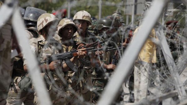 Soldiers of the Egyptian Army stand guard in front of the headquarters of the Egyptian Republican Guard in Nasr City on July 5, 2013 in Cairo, Egypt.  (Photo by Ed Giles/Getty Images).
