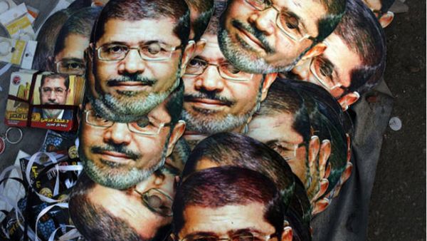 CAIRO, EGYPT - JULY 12: Mohamed Morsi masks are displayed for sale at the base for supporters of ousted president Morsi on the third day of Ramadan, the sacred holy month for Muslims where many will fast from sun-up to sun-down on July 12, 2013 in Cairo, Egypt. ( Spencer Platt/Getty Images)