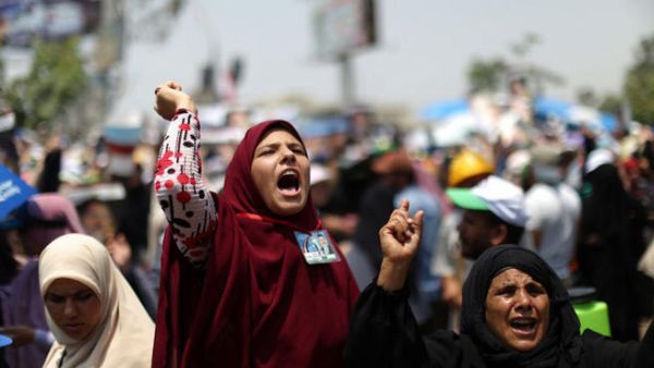 Women out in force for the sexual fatwa to bolster their main man Morsi  (AFP PHOTO / MAHMUD HAMS)