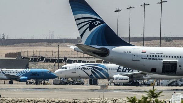 EgyptAir planes are seen on the tarmac at Cairo international airport on May 19, 2016 after an EgyptAir flight from Paris to Cairo crashed into the Mediterranean on with 66 people on board, prompting an investigation into whether it was mechanical failure or a bomb. (AFP/Khaled Desouki)
