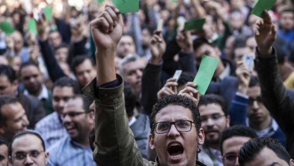 Egyptian doctors gather outside their union in Cairo on Feb. 12, to protest against an alleged assault by policemen on two of their colleagues in a public hospital last month. (AFP/Mahmoud Khaled)
