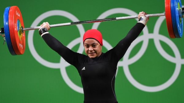 Egypt's Sara Ahmed competes during the Women's 69kg weightlifting competition at the Rio 2016 Olympic Games in Rio de Janeiro on August 10, 2016. (AFP/Goh Chai Hin)