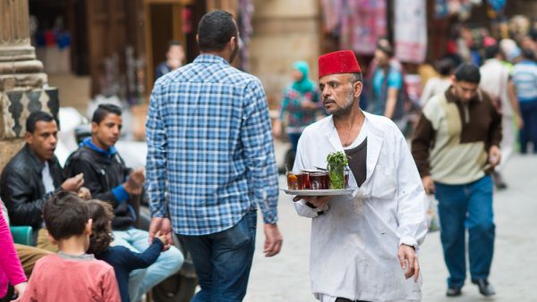 A man serving tea in Cairo. (Shutterstock/ Orhan Cam)