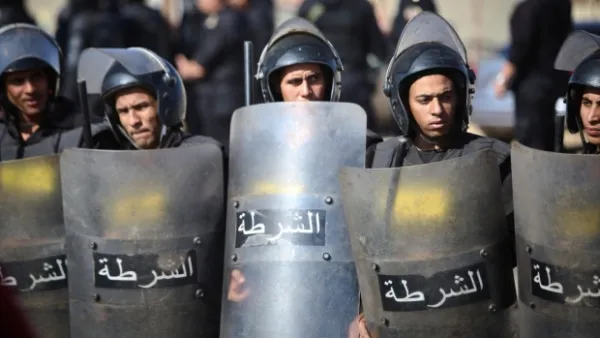 Egyptian police are seen in riot gear at a protest. (AFP)