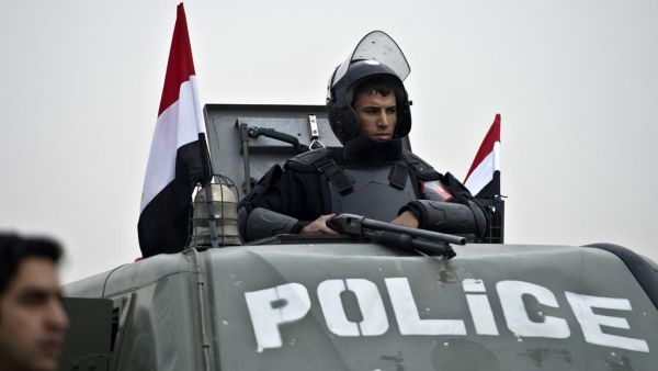 An Egyptian policeman stands guard from an armoured vehicle outside the venue of the trial of the ousted Islamist president Mohammed Morsi. (AFP/ File Photo)