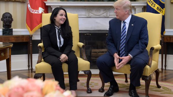Donald Trump greets Egyptian-American Aya Hejazi, after working behind scenes to free her. (AFP/File)