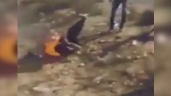 A screengrab shows a Daesh leader trying to extinguish the flames by rolling on the ground. (YouTube)