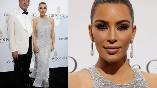 A finery pair: Kim and Fawaz were never far apart during the event. (AFP/Jean Christophe Magnenet) 